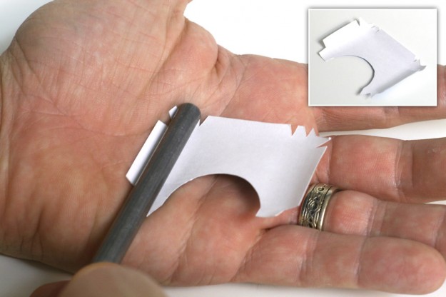 Pre-bending a paper model piece in your hand